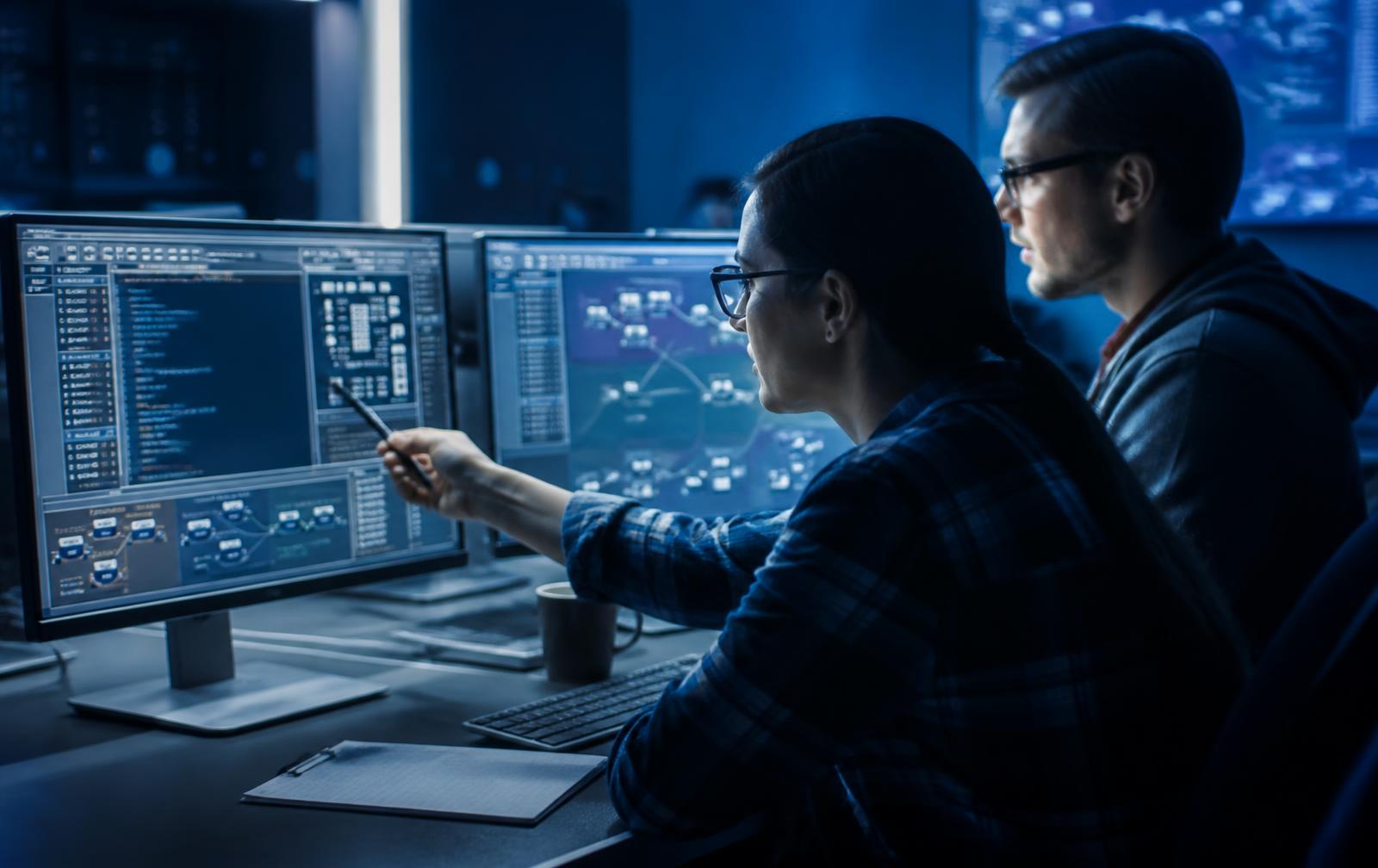 Security analysts reviewing compliance dashboards